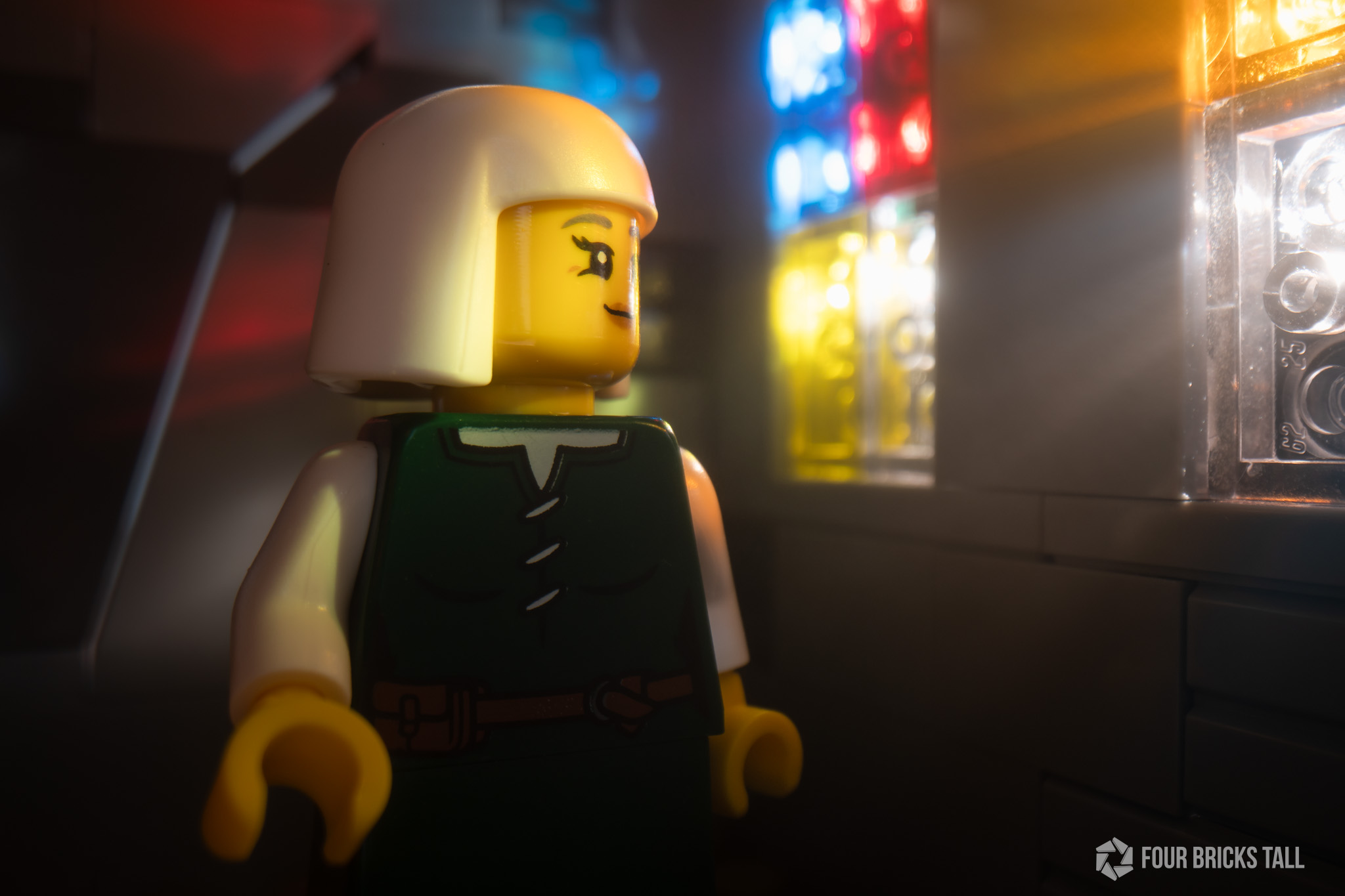 Medieval minifigure looking into stained glass window light