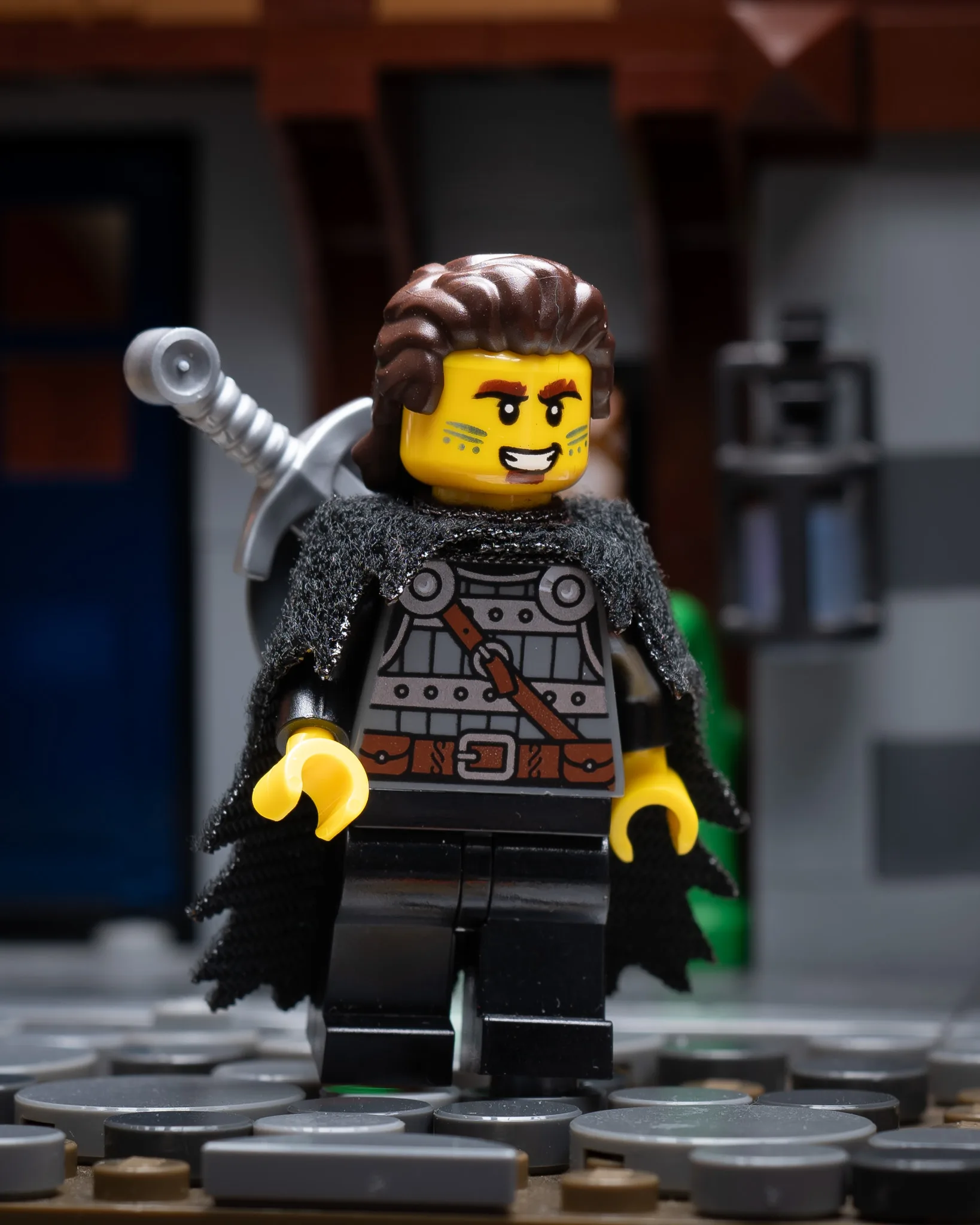 LEGO medieval fighter minifigure with fur cloak and sword in sheath