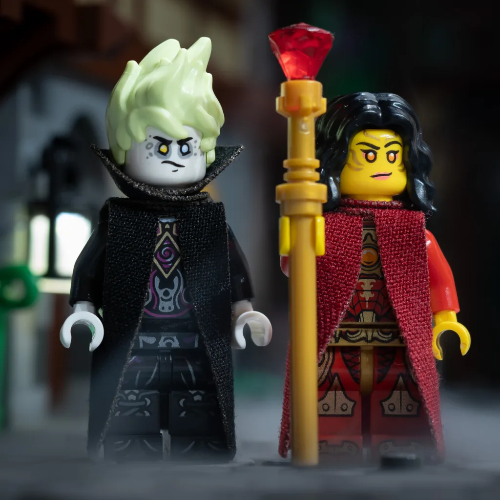 Two LEGO dark sorcerers wearing cloth robes