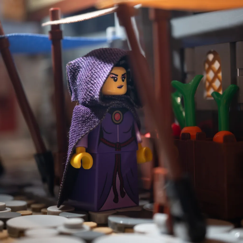 LEGO sorceress minifigure in purple cloak and hood